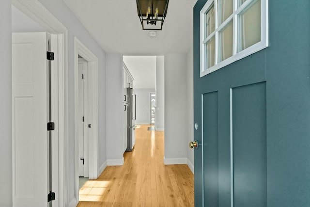 hallway featuring light wood-type flooring