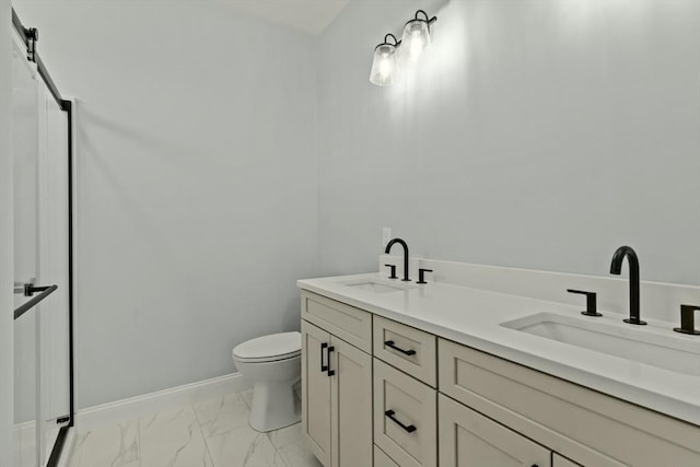 50 Yvonne Ln, Rehoboth, MA 02769 - bathroom featuring marble finish floors, baseboards, toilet, and double vanity