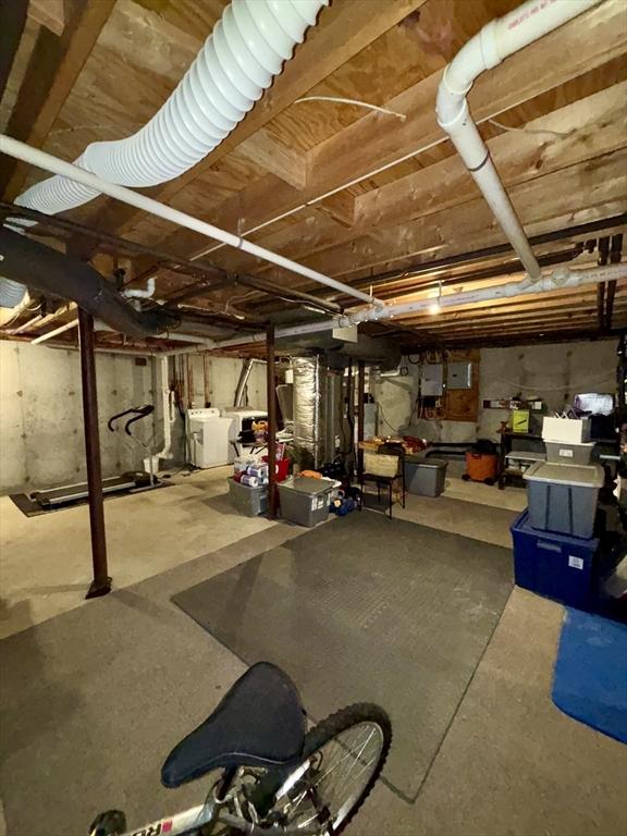 unfinished basement featuring independent washer and dryer