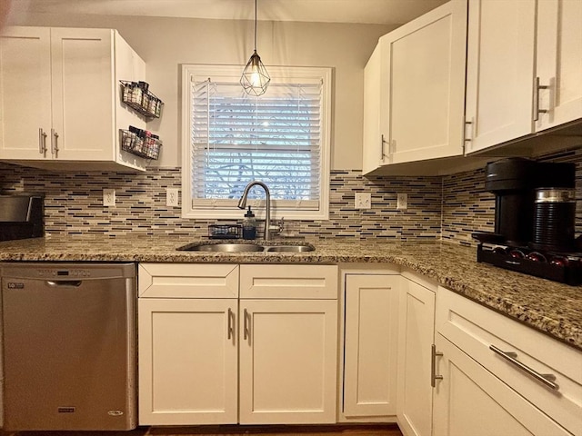 kitchen featuring a sink, decorative backsplash, dishwasher, and white cabinets