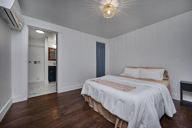 3030 Main St, Palmer, MA 01009 - bedroom featuring an AC wall unit, wood finished floors, and connected bathroom