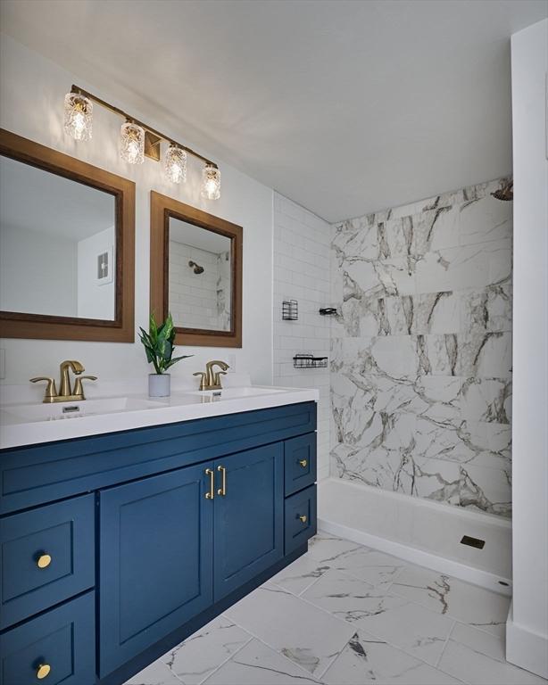 3030 Main St, Palmer, MA 01009 - bathroom featuring double vanity, marble finish flooring, and shower / washtub combination