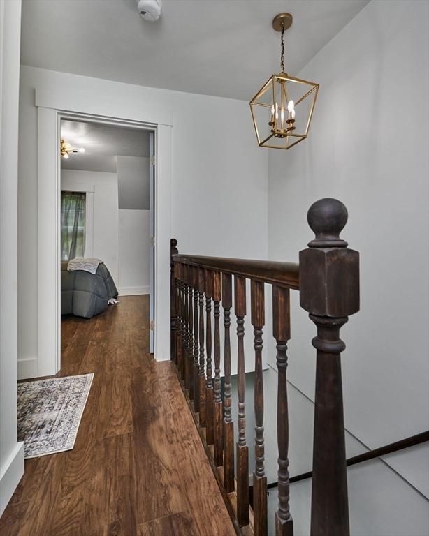 3030 Main St, Palmer, MA 01009 - corridor featuring an upstairs landing, a chandelier, and wood finished floors
