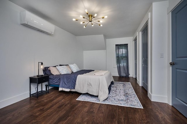 3030 Main St, Palmer, MA 01009 - bedroom featuring a wall unit AC, a chandelier, and wood finished floors