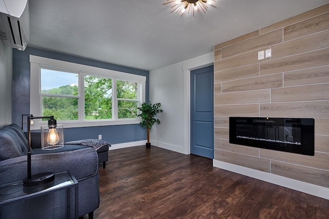 3030 Main St, Palmer, MA 01009 - living area featuring dark wood-style flooring, a tile fireplace, and an AC wall unit