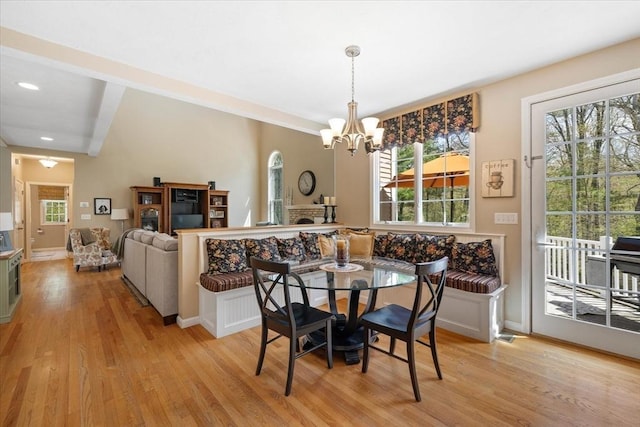 dining space featuring recessed lighting, baseboards, a notable chandelier, and light wood-type flooring