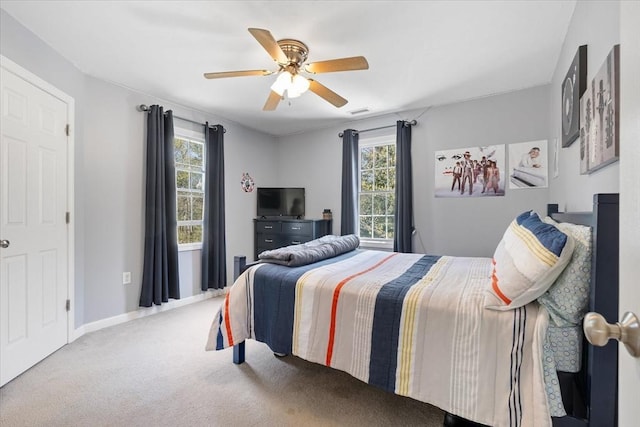 bedroom featuring baseboards, carpet, and a ceiling fan