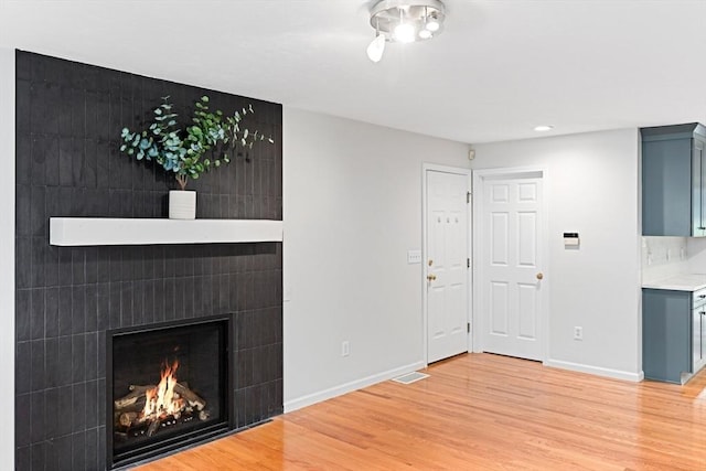15 Pilgrim Rd, Mansfield, MA 02048 - unfurnished living room featuring baseboards, light wood finished floors, recessed lighting, and a large fireplace