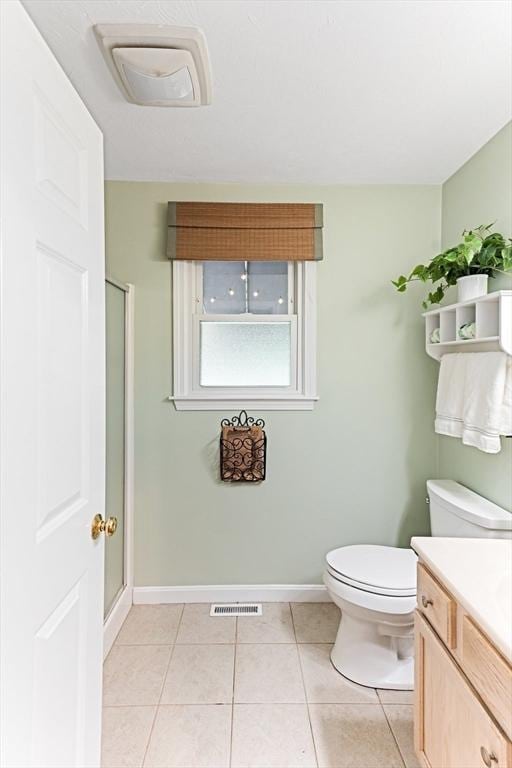 15 Pilgrim Rd, Mansfield, MA 02048 - bathroom with vanity, toilet, baseboards, a stall shower, and tile patterned flooring