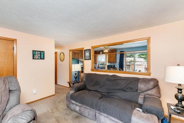 24 Alenclair, Amesbury, MA 01913 - living area featuring light colored carpet and a ceiling fan