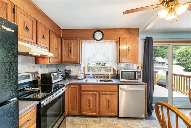 24 Alenclair, Amesbury, MA 01913 - kitchen featuring stainless steel appliances, under cabinet range hood, brown cabinetry, and ceiling fan