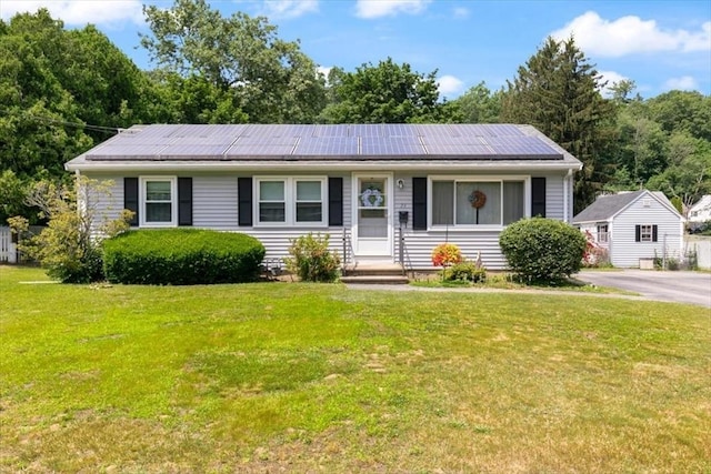24 Alenclair, Amesbury, MA 01913 - view of front of home with solar panels and a front lawn