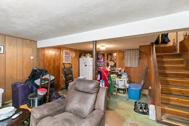 24 Alenclair, Amesbury, MA 01913 - living room featuring wood walls, a textured ceiling, and stairs