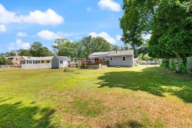 24 Alenclair, Amesbury, MA 01913 - fenced backyard featuring a wooden deck and a shed