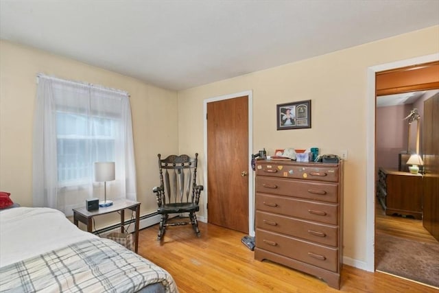 24 Alenclair, Amesbury, MA 01913 - bedroom featuring a baseboard radiator and light wood-type flooring