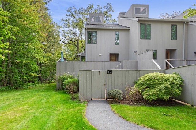 94 Mill Pond Unit 94, North Andover, MA 01845 - back of property featuring a lawn