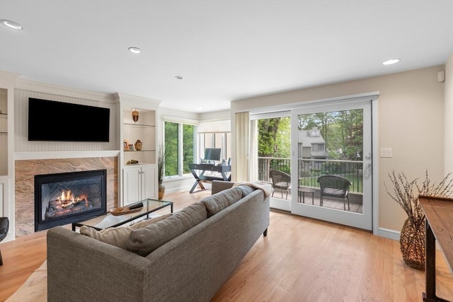 94 Mill Pond Unit 94, North Andover, MA 01845 - living area with a premium fireplace, light wood-style flooring, recessed lighting, and baseboards