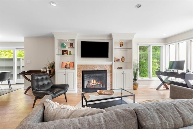 94 Mill Pond Unit 94, North Andover, MA 01845 - living area featuring a premium fireplace, light wood-type flooring, recessed lighting, and baseboards