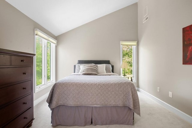 94 Mill Pond Unit 94, North Andover, MA 01845 - bedroom with light carpet, vaulted ceiling, multiple windows, and baseboards