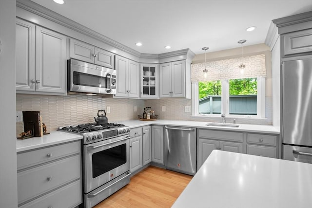 94 Mill Pond Unit 94, North Andover, MA 01845 - kitchen with gray cabinets, stainless steel appliances, backsplash, glass insert cabinets, and recessed lighting
