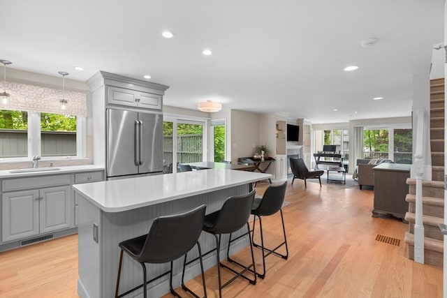 94 Mill Pond Unit 94, North Andover, MA 01845 - kitchen featuring high end refrigerator, gray cabinets, a sink, plenty of natural light, and recessed lighting