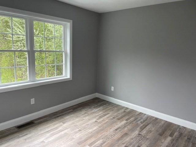 25 Ash St, Webster, MA 01570 - unfurnished room featuring baseboards and wood finished floors