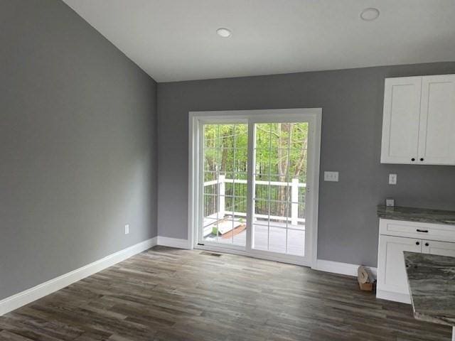 25 Ash St, Webster, MA 01570 - unfurnished dining area featuring baseboards and dark wood finished floors