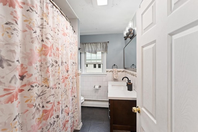 140 W Mountain St, Worcester, MA 01606 - full bath featuring tile patterned flooring, tile walls, vanity, toilet, and a baseboard radiator