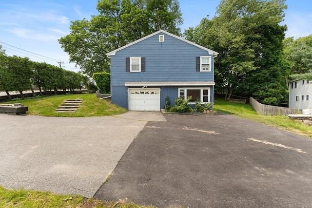140 W Mountain St, Worcester, MA 01606 - view of side of home with asphalt driveway and a garage