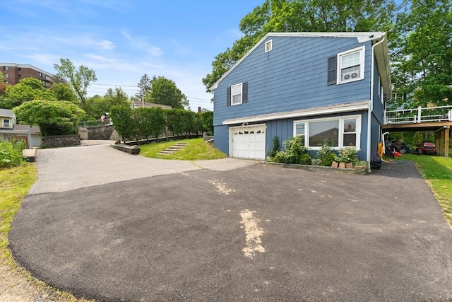 140 W Mountain St, Worcester, MA 01606 - view of side of home with driveway, a wooden deck, and a garage
