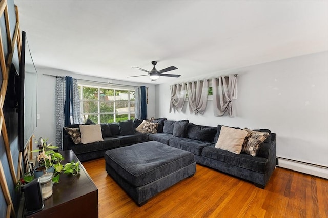 140 W Mountain St, Worcester, MA 01606 - living room featuring wood finished floors, a ceiling fan, and a baseboard radiator