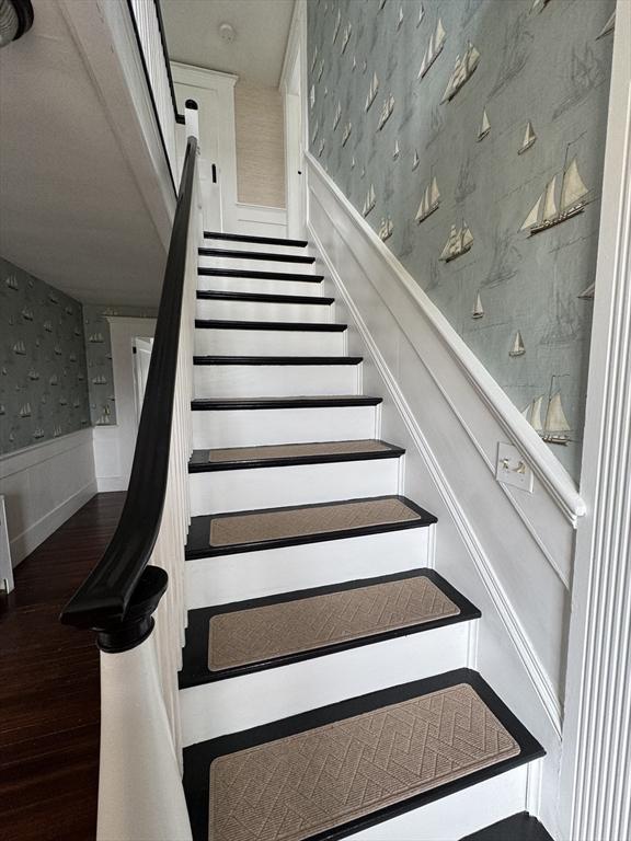 36 Uncle Barneys Rd, Dennis, MA 02670 - stairs with wallpapered walls, wainscoting, and wood finished floors