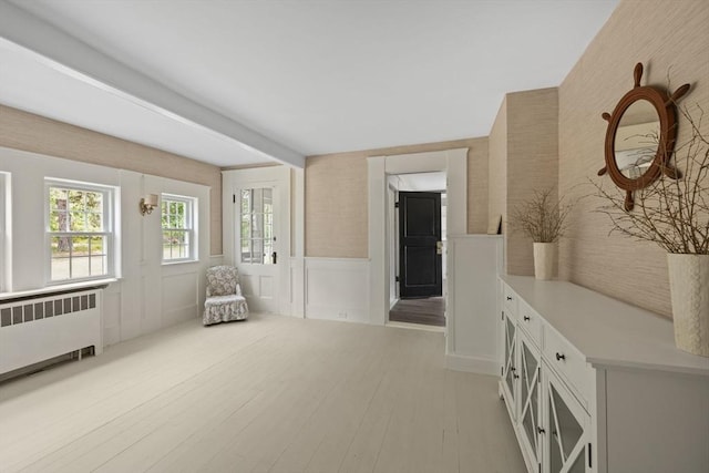 36 Uncle Barneys Rd, Dennis, MA 02670 - unfurnished room with radiator, wainscoting, light wood-type flooring, a decorative wall, and wallpapered walls