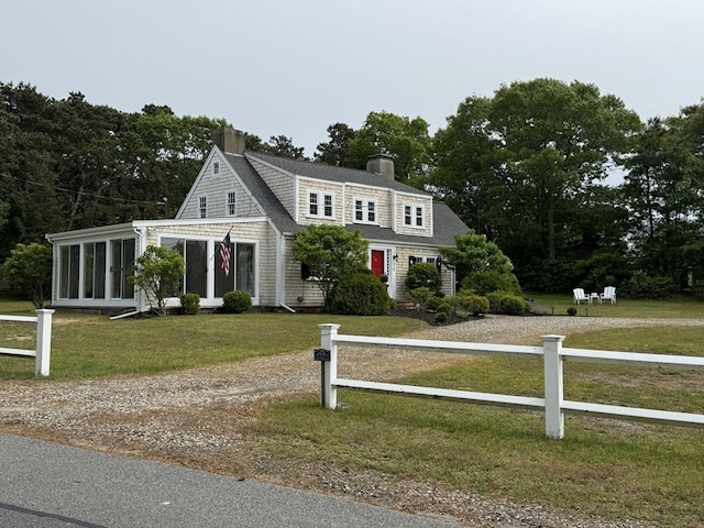 36 Uncle Barneys Rd, Dennis, MA 02670 - shingle-style home with a chimney and a sunroom