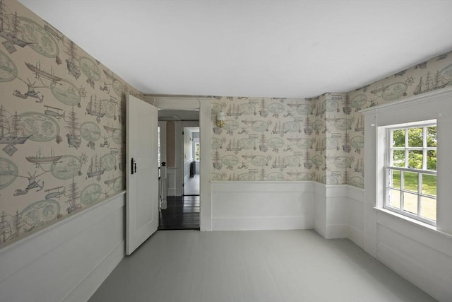 36 Uncle Barneys Rd, Dennis, MA 02670 - empty room featuring wallpapered walls and a wainscoted wall