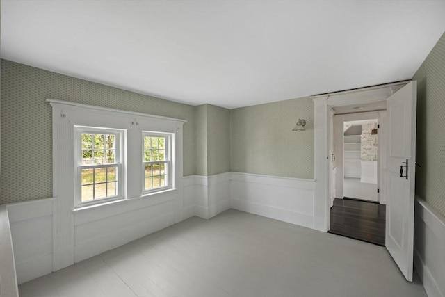 36 Uncle Barneys Rd, Dennis, MA 02670 - spare room featuring a wainscoted wall and wallpapered walls