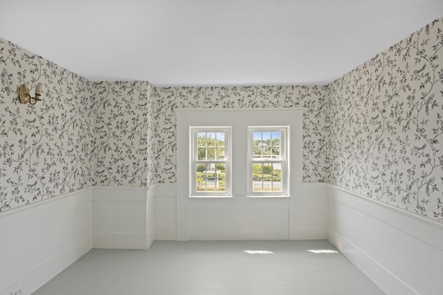 36 Uncle Barneys Rd, Dennis, MA 02670 - empty room featuring wallpapered walls and a wainscoted wall
