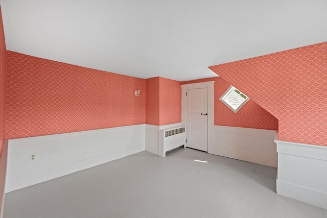 36 Uncle Barneys Rd, Dennis, MA 02670 - additional living space featuring wallpapered walls and radiator heating unit