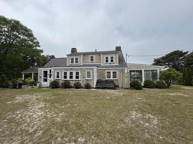 36 Uncle Barneys Rd, Dennis, MA 02670 - rear view of property featuring a chimney and a yard