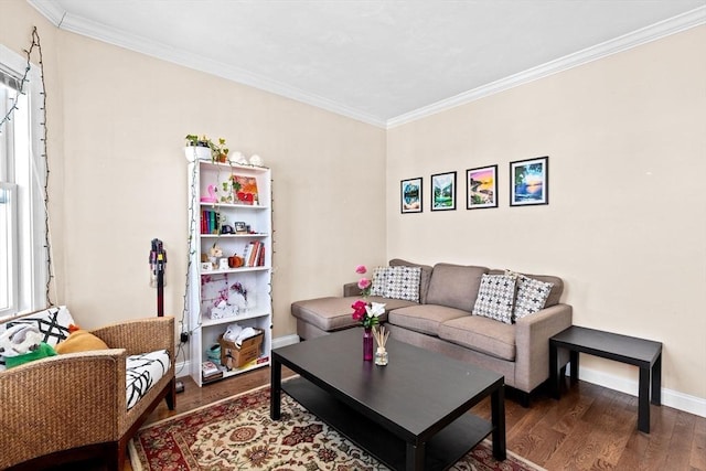 living room with baseboards, crown molding, and wood finished floors