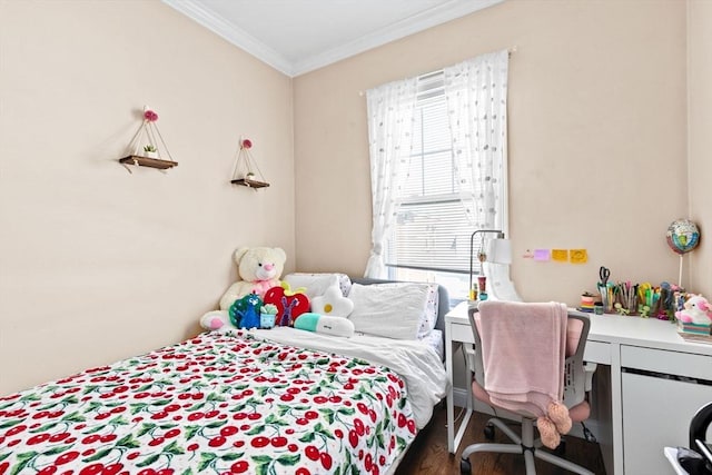 bedroom with wood finished floors and ornamental molding