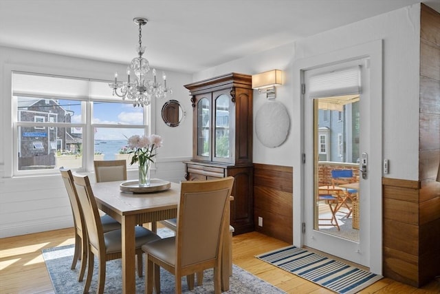 13 Selman St, Marblehead, MA 01945 - dining space with a chandelier, healthy amount of natural light, and light wood finished floors