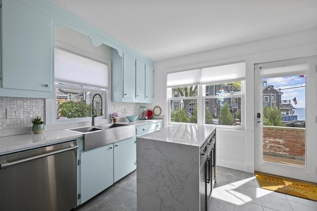 13 Selman St, Marblehead, MA 01945 - kitchen with stainless steel dishwasher, tile patterned flooring, and healthy amount of natural light