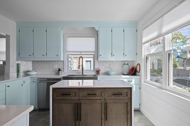 13 Selman St, Marblehead, MA 01945 - kitchen featuring dishwasher, a sink, decorative backsplash, and light countertops