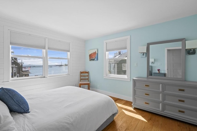 13 Selman St, Marblehead, MA 01945 - bedroom featuring multiple windows, wood finished floors, and baseboards