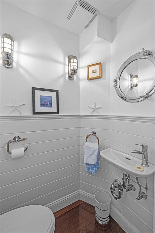 13 Selman St, Marblehead, MA 01945 - bathroom featuring wood finished floors and toilet