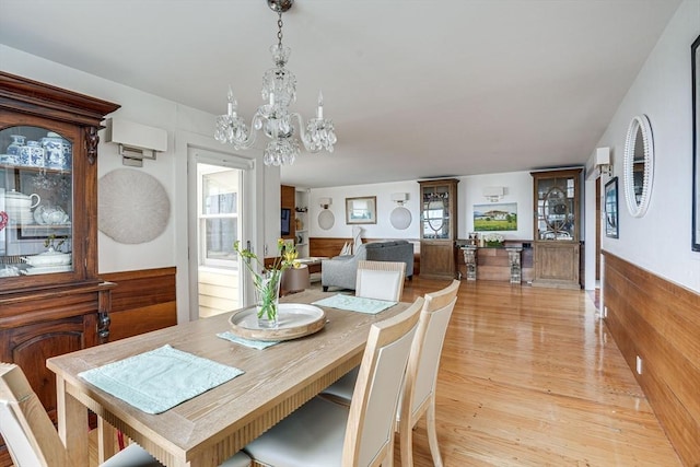 13 Selman St, Marblehead, MA 01945 - dining space with a chandelier and light wood-type flooring