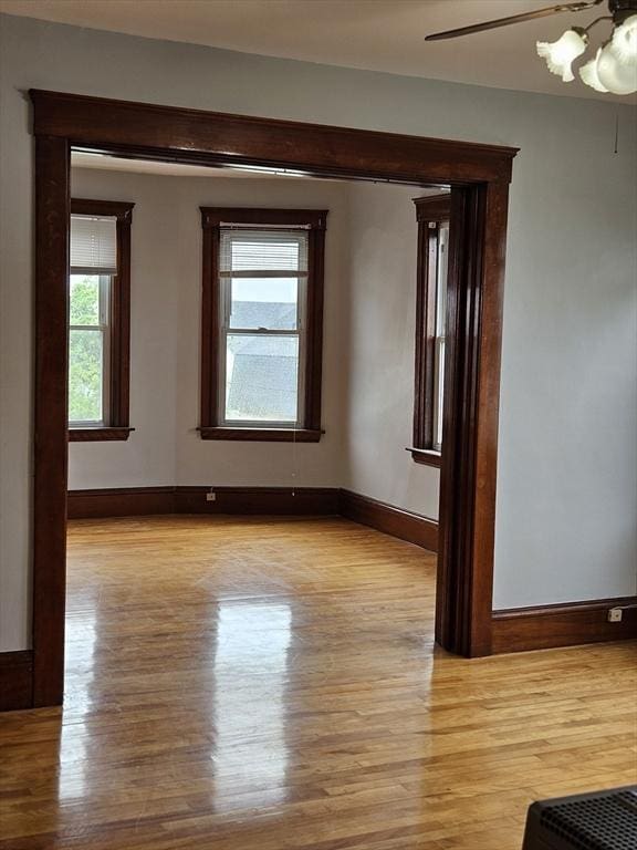 5 Watson Ave, Worcester, MA 01606 - empty room featuring light wood finished floors and a chandelier