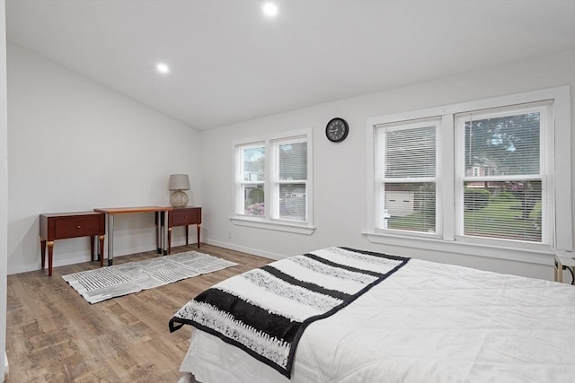 12 Temple Ave, Hudson, MA 01749 - bedroom with vaulted ceiling, wood finished floors, baseboards, and recessed lighting