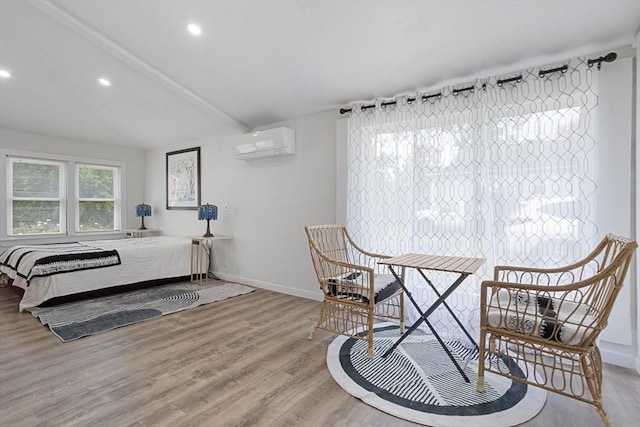 12 Temple Ave, Hudson, MA 01749 - bedroom featuring a wall mounted AC, wood finished floors, baseboards, and recessed lighting